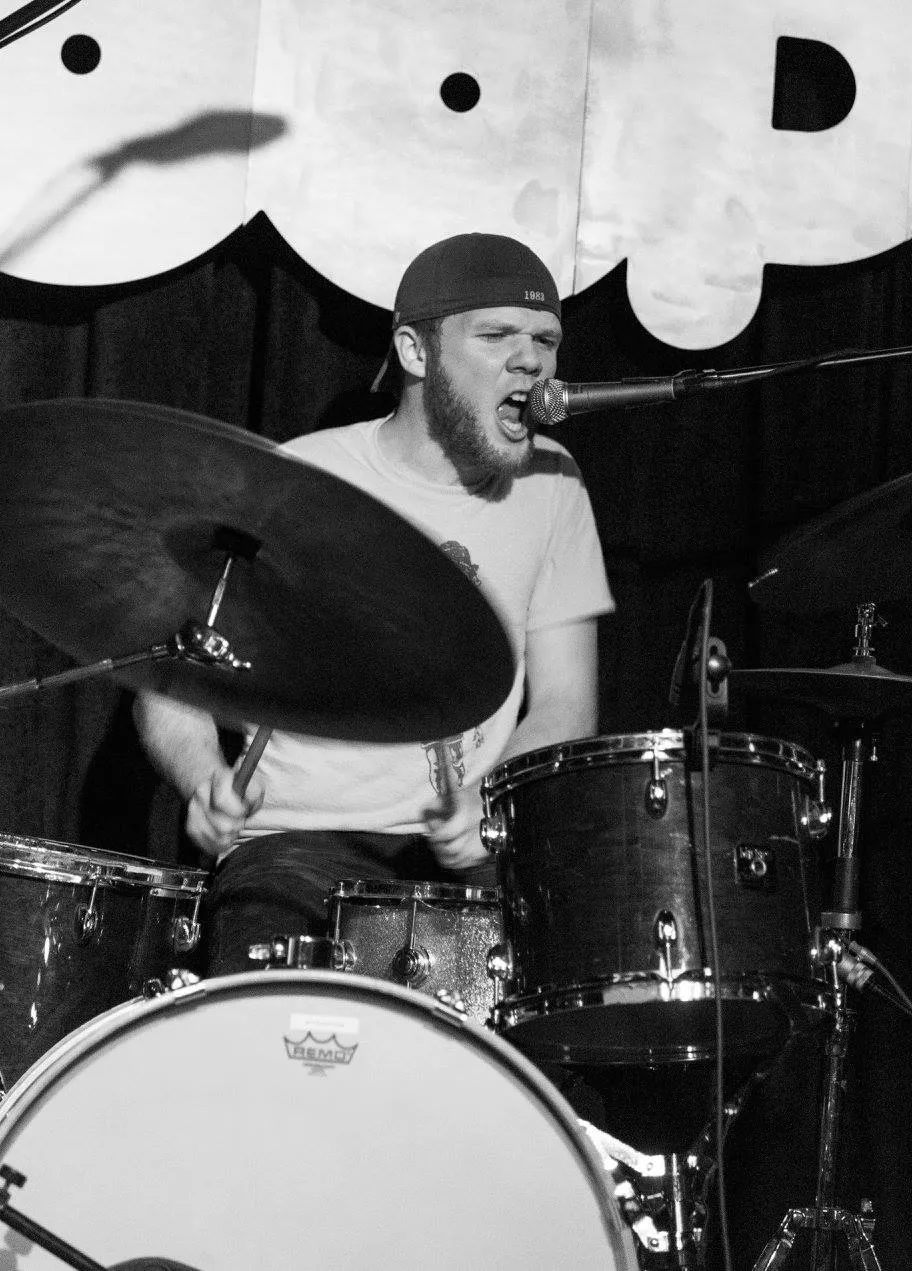 Brendan Smyth playing drums and singing